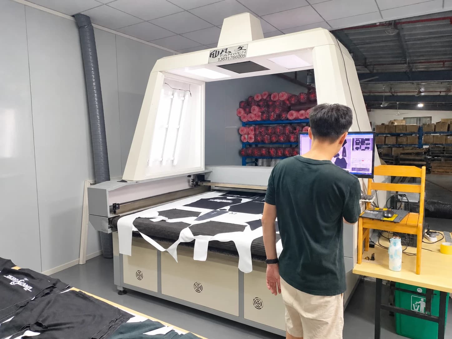 Operator at a fabric cutting workstation