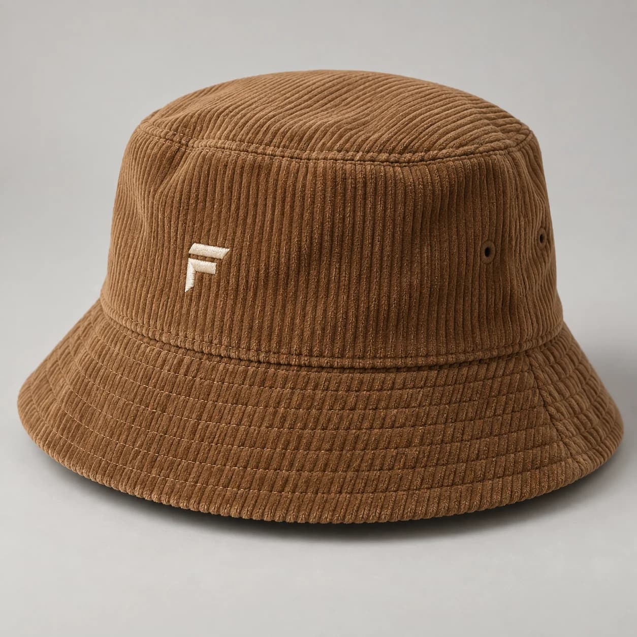 AI-generated corduroy bucket hat design reference illustrating textured crown / soft brim