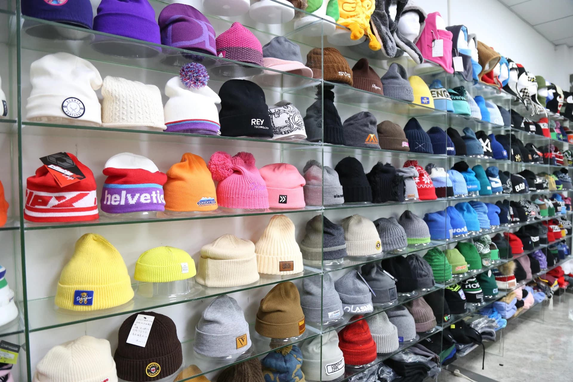 Knitted headwear samples displayed on shelves
